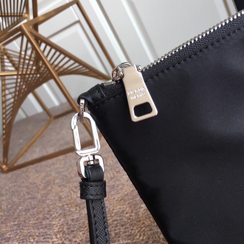Pra*a clutch bags